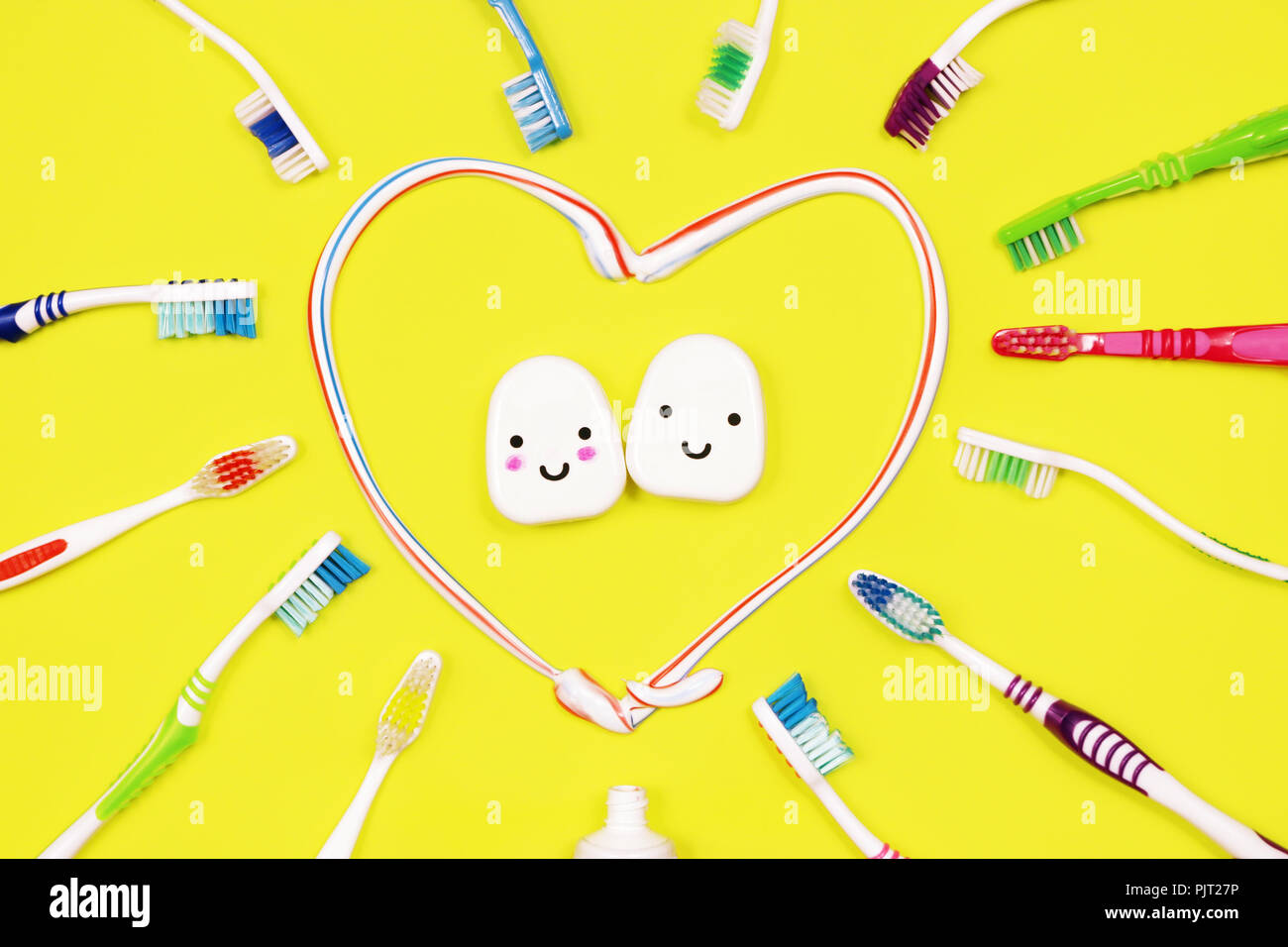 Toothbrushes and dental floss on yellow background,top view Stock Photo ...