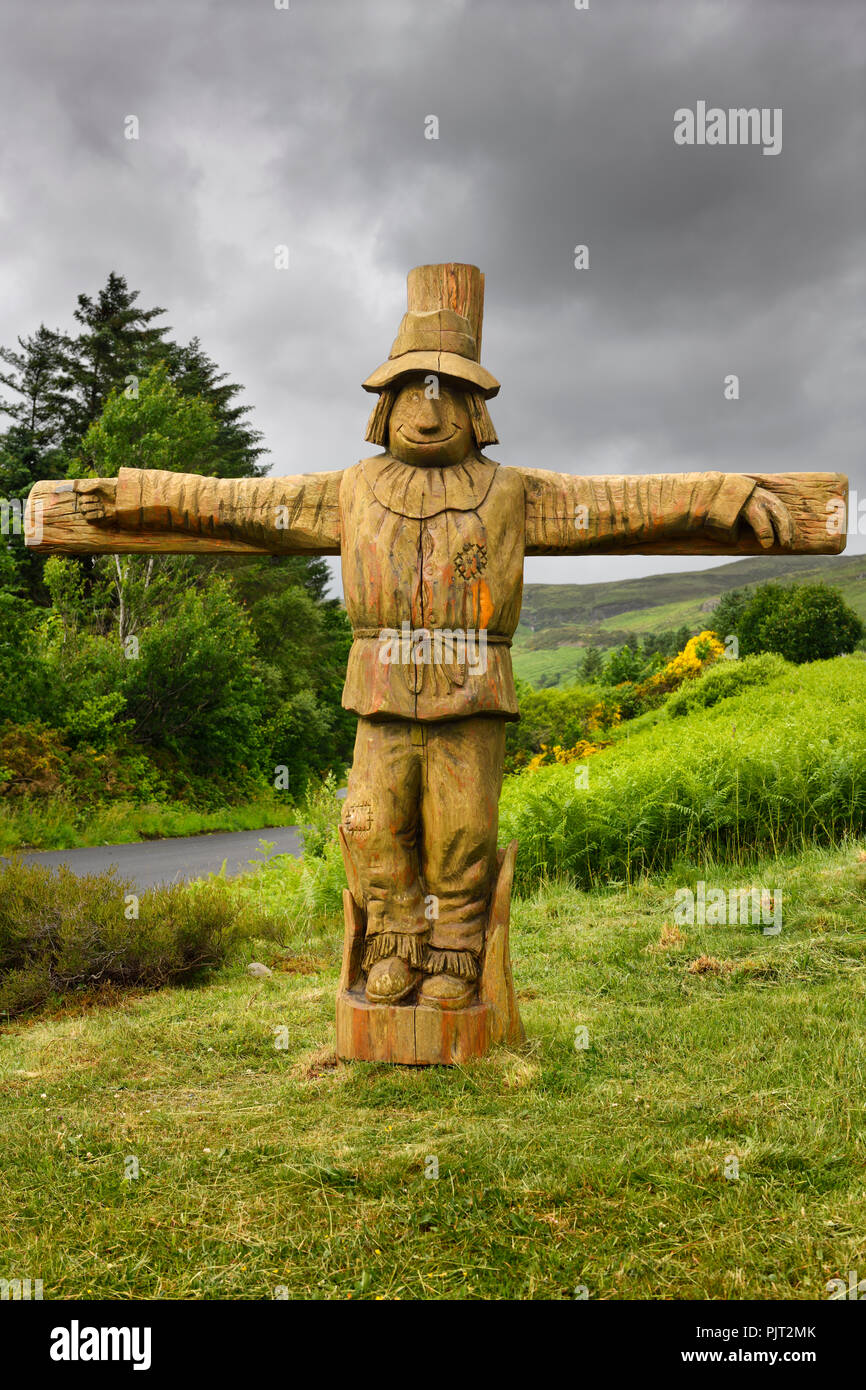 Carved wood life size Tattie Bogle Scarecrow previously pointing to the Tattie Bogal trail on Carbost Road Drynoch Isle of Skye Scotland UK Stock Photo