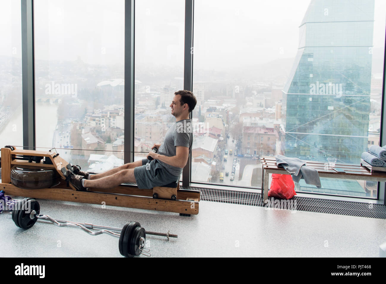 Man on rower machine hi-res stock photography and images - Alamy