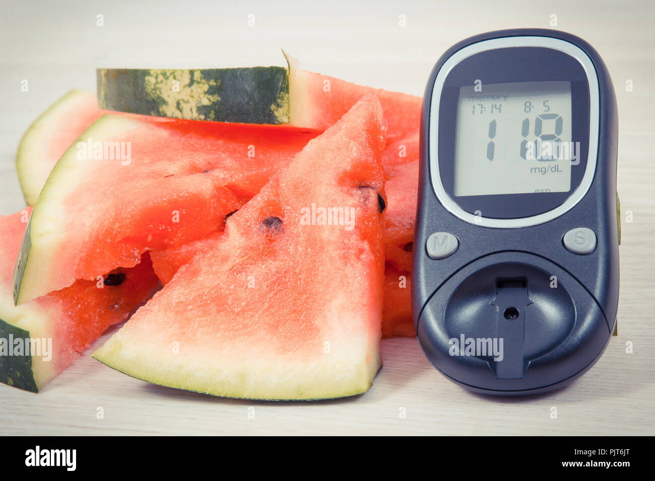 Watermelon and glucose meter for measuring sugar level, concept of diabetes,  healthy lifestyles and nutrition Stock Photo - Alamy
