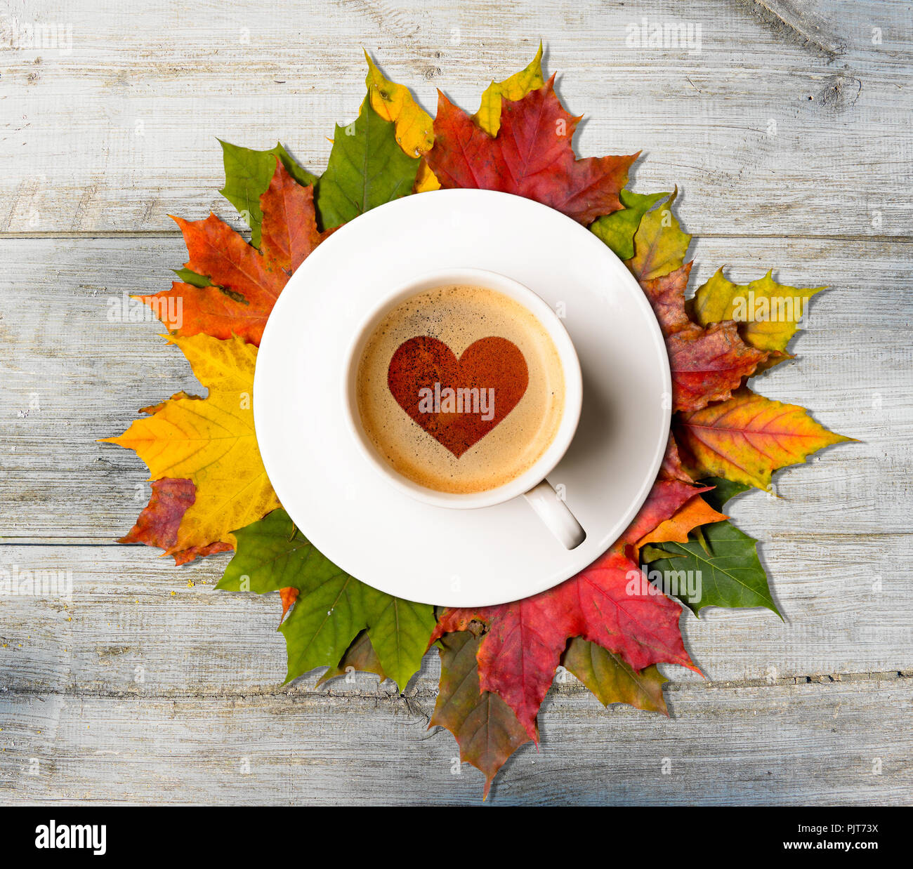 Fall in love. Autumn coffee and leaves Stock Photo