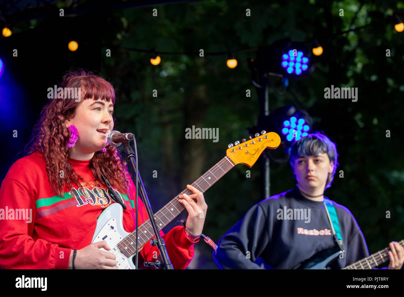 Welsh musicians from band Adwaith playing at the Y Bandstand at the last ever Festival Number 6 at Pormeirion, Wales Stock Photo