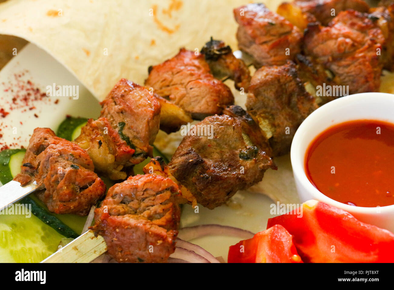 Beef bbq with onion and sauce Stock Photo Alamy