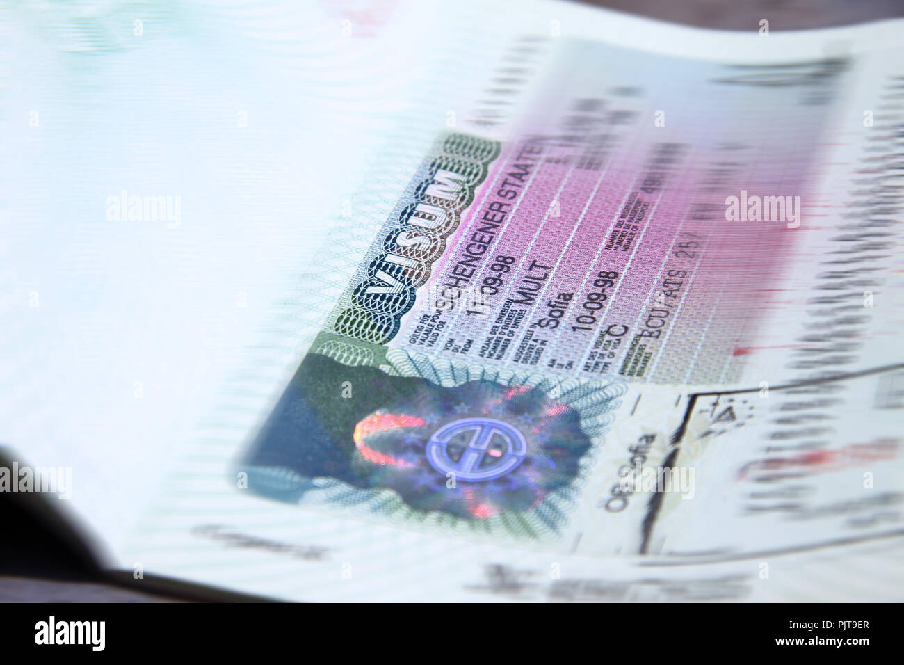 Schengen visa stamp in international passport. Shengen document for pass  customs control on border of a country. Document for travel Stock Photo -  Alamy