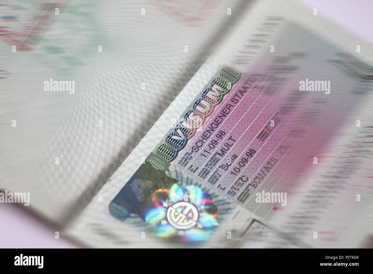 Schengen Visa Stamp In International Passport Shengen Document For Pass Customs Control On 2402