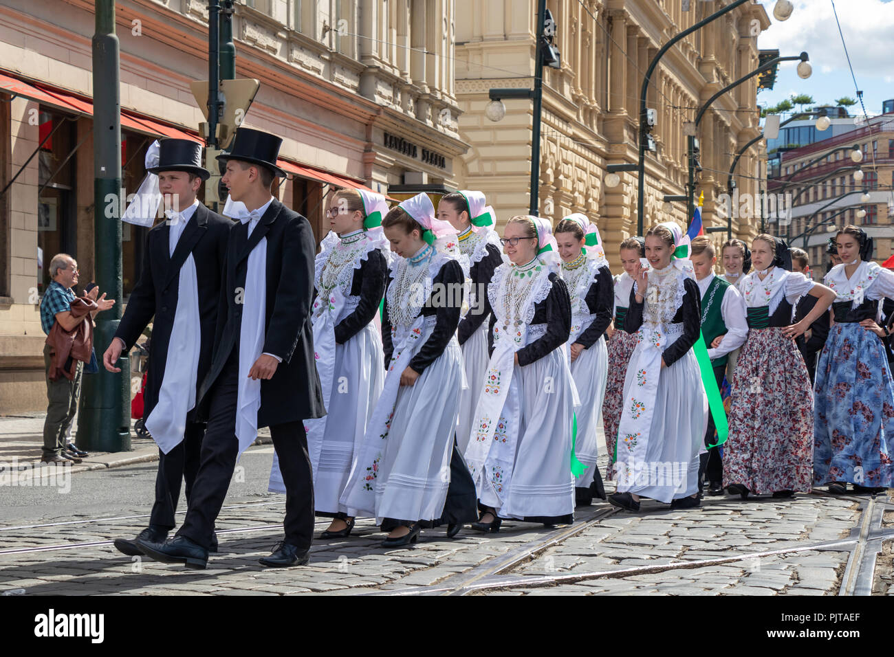 PRAGUE, CZECH REPUBLIC - JULY 1, 2018: People in folk costumes parading at Sokolsky Slet, a once-every-six-years gathering of the Sokol movement - a C Stock Photo