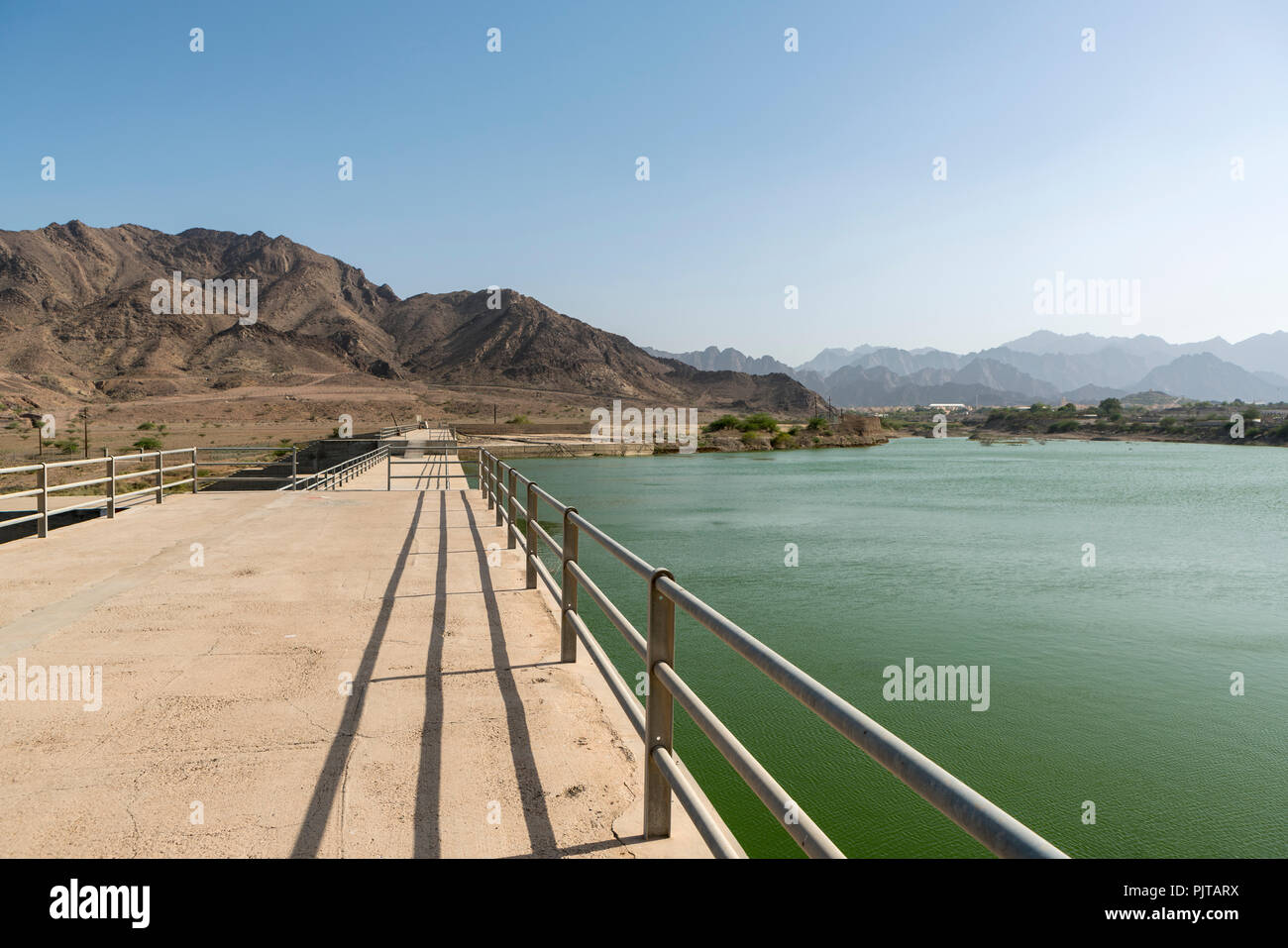 Reservoir and dam in Hatta, an enclave of the emirate of Dubai in the Hajar Mountains, United Arab Emirates Stock Photo