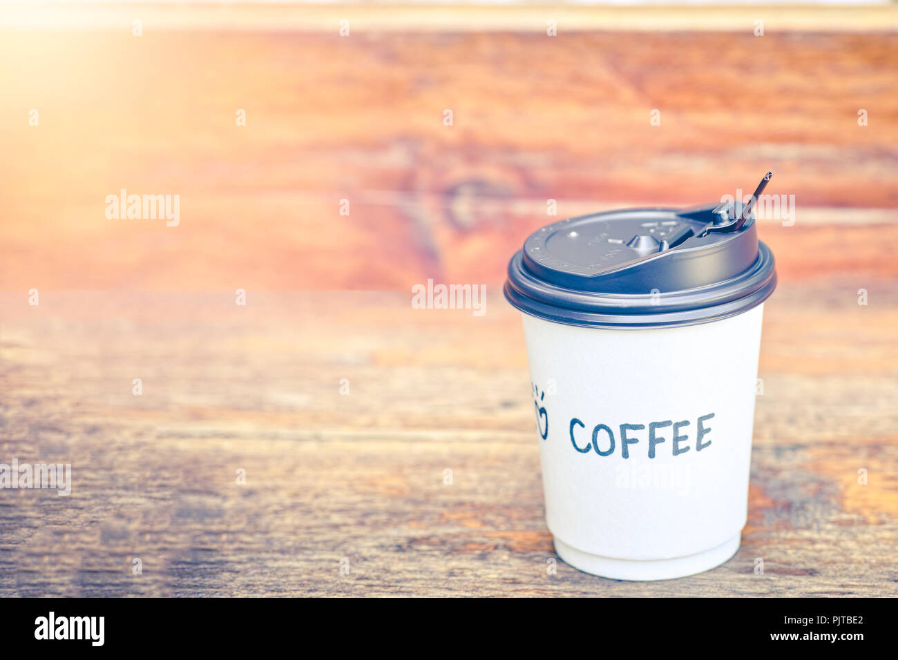 Coffee in paper cup with love coffee text writing massage Stock Photo