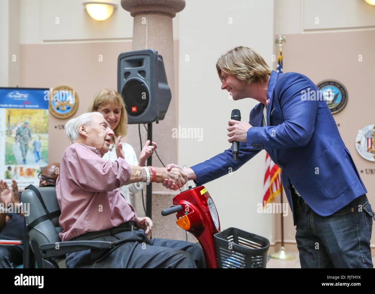 Beau Davidson sings for a Veteran at the West Palm VA Medical Center (West Palm Beach, FL). Stock Photo