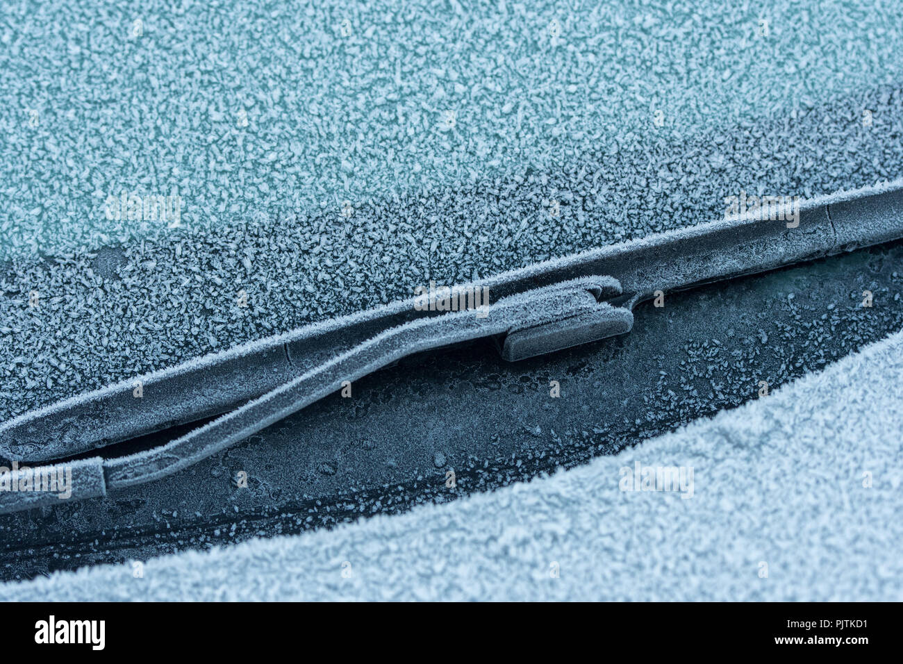 Frost crystals formed on car windscreen. Stock Photo