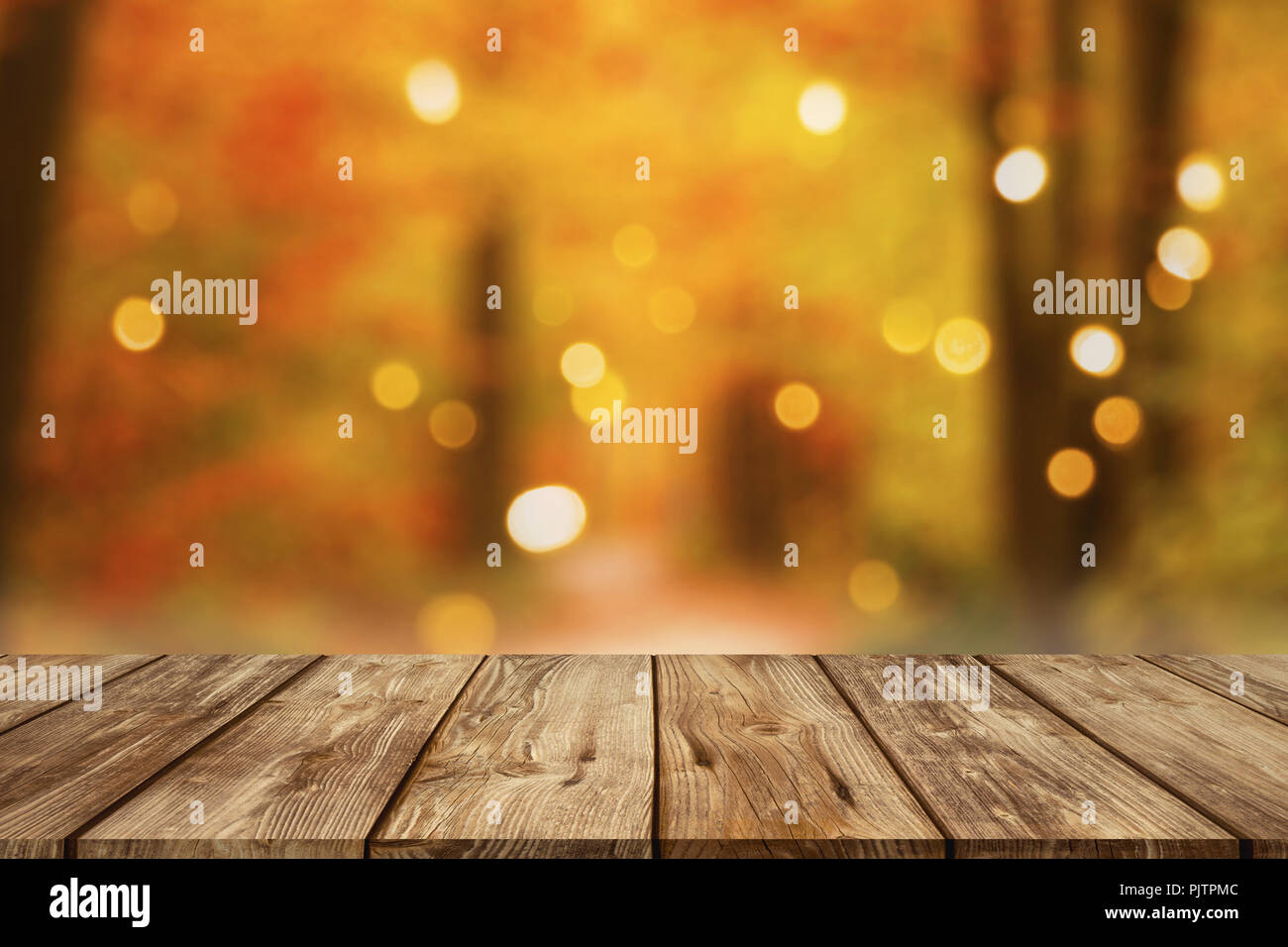 wooden table with blurred autumn forest background Stock Photo - Alamy