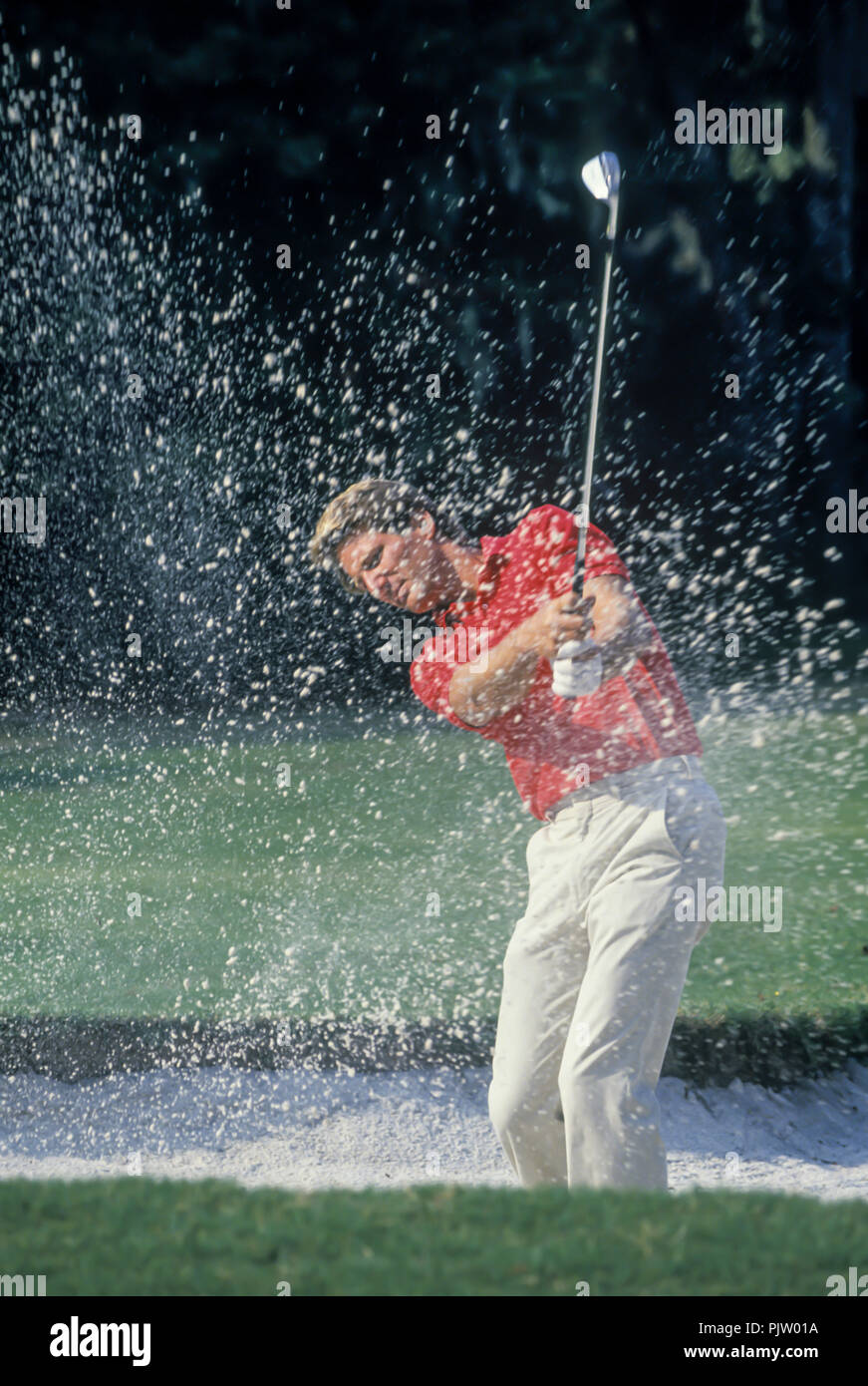 1990 HISTORICAL GOLFER HITS BALL OUT OF SAND TRAP ON TO PUTTING GREEN
