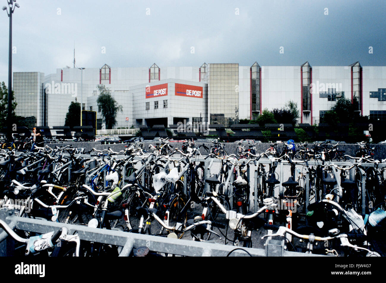 Bicycle parking space and the old "De Post" sorting centre at Antwerp  Berchem station (31/08/2006 Stock Photo - Alamy