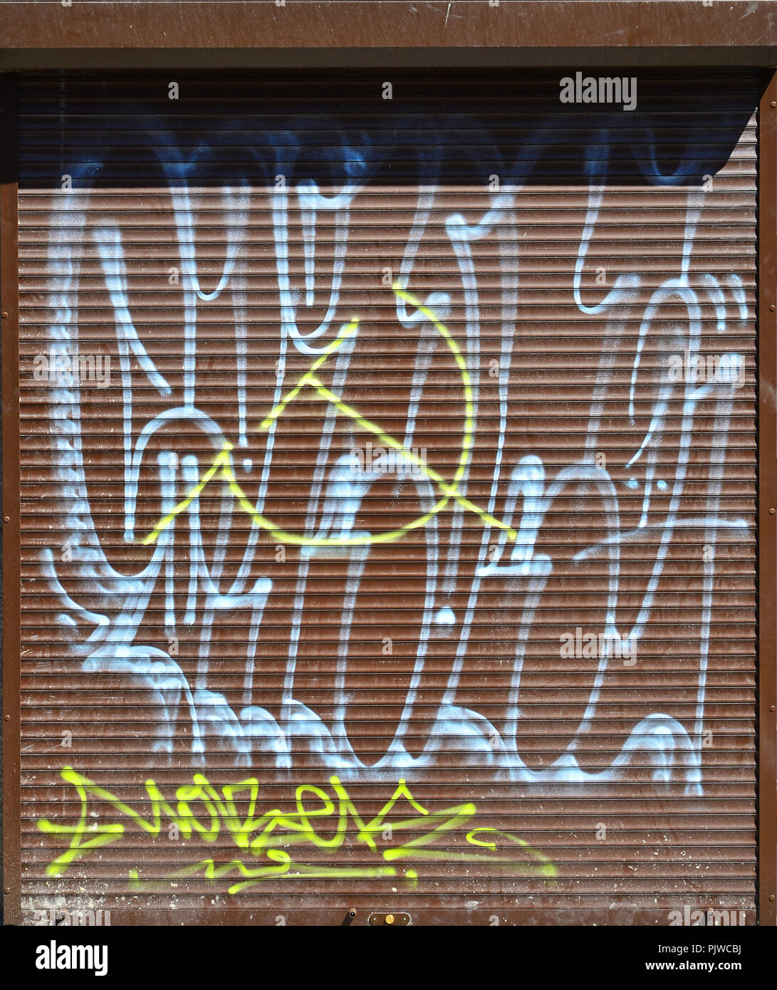 Fragment Of An Old Colored Graffiti Drawing On The Shutter Door Background Image As An Illustration Of Street Art Vandalism And Wall Painting With A Stock Photo Alamy
