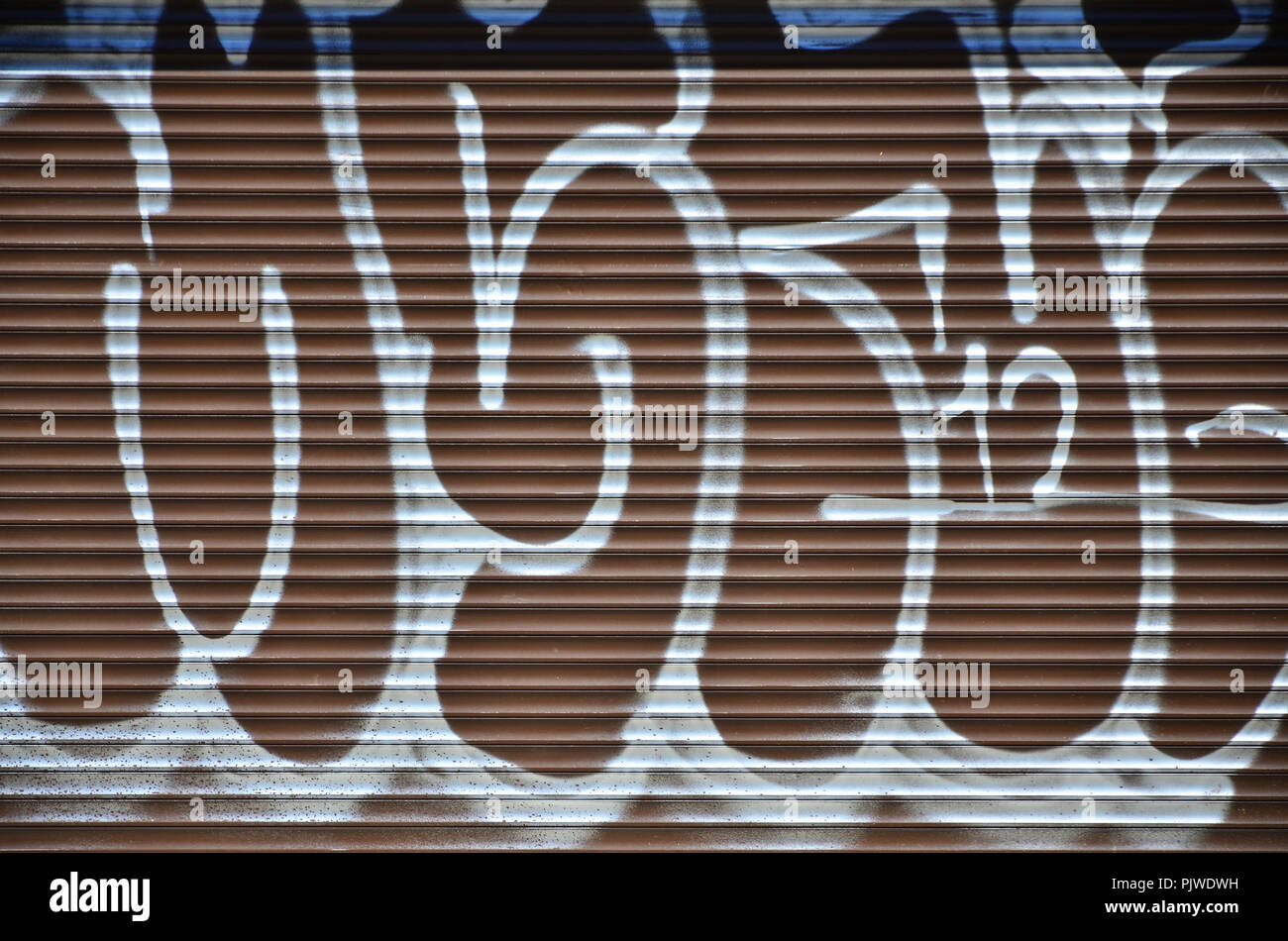 Fragment Of An Old Colored Graffiti Drawing On The Shutter Door Background Image As An Illustration Of Street Art Vandalism And Wall Painting With A Stock Photo Alamy