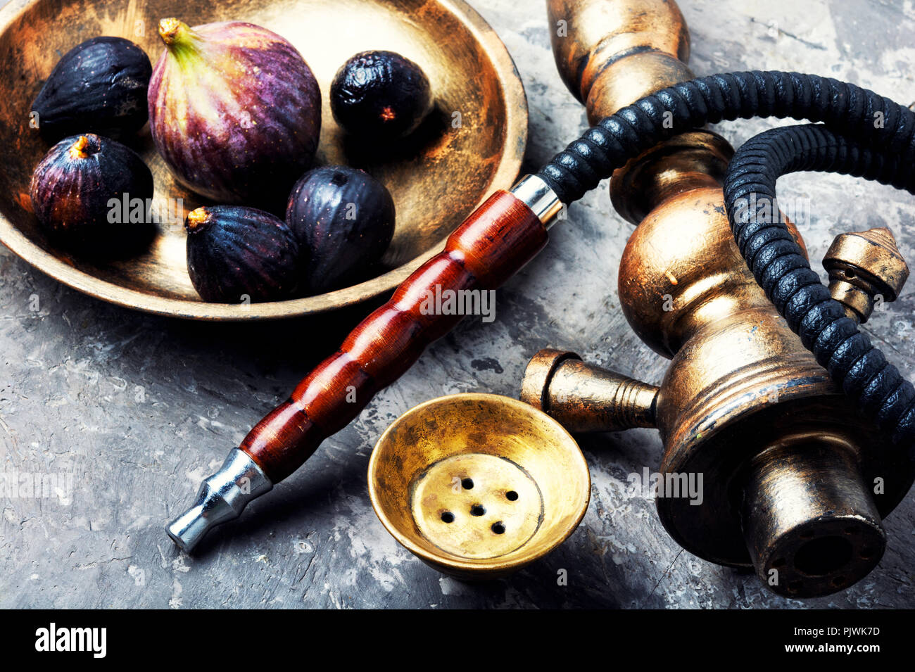Fashionable fruit smoking hookah with a tobacco flavor of figs.Eastern  shisha.Smoking hookah Stock Photo