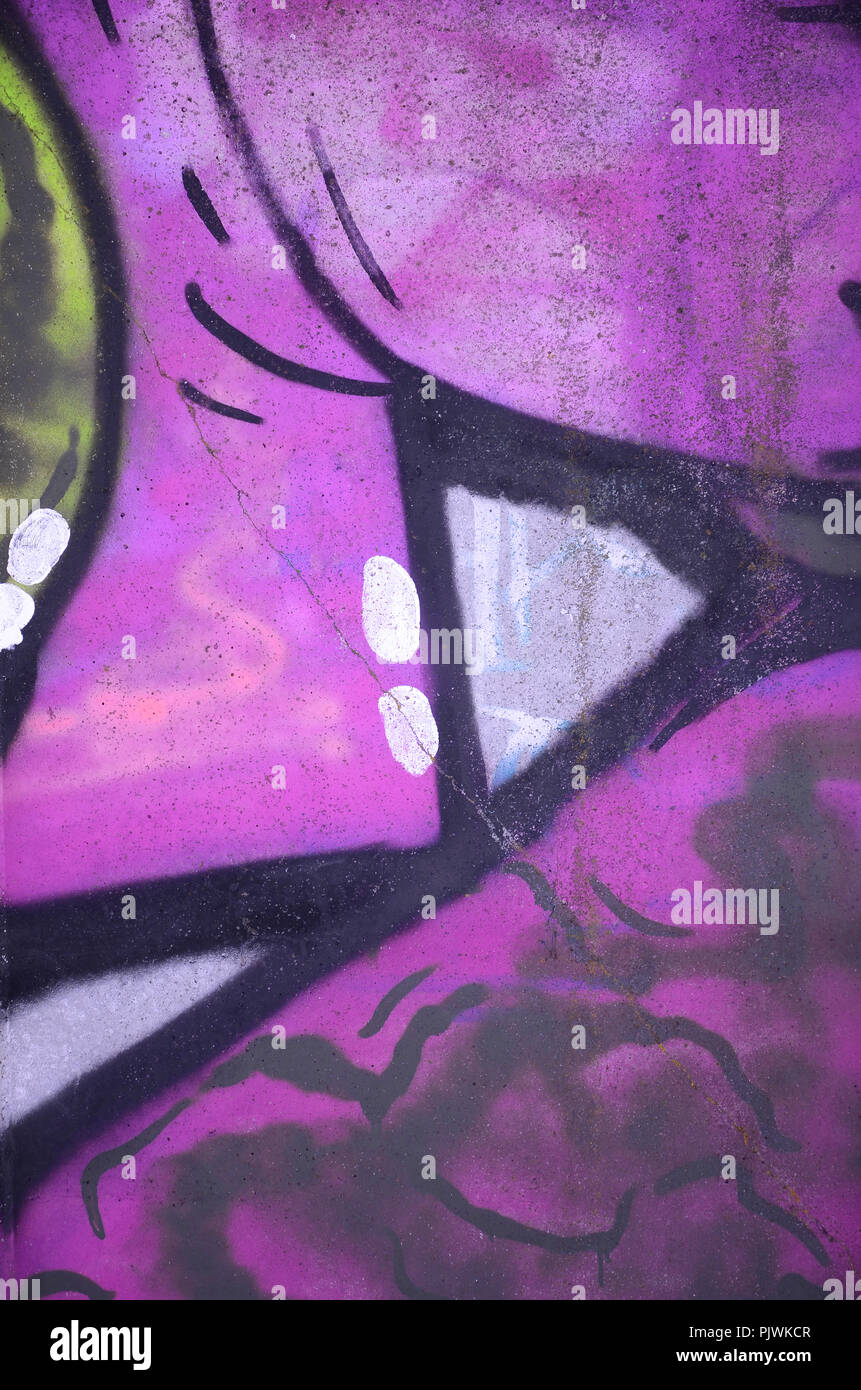 Closeup fragment of a graffiti drawing applied to the wall by aerosol