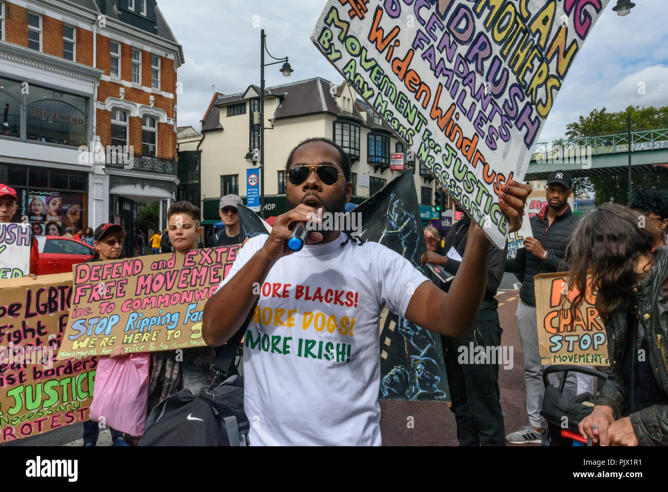 London, UK. 8th September 2018. A march through Brixton goes down the main street past the Underground station calling for the Windrush scheme to be widened to include all families and descendants of the Windrush Generation and for an end to the racist hostile environment for all immigrants. It demanded an amnesty for those living here without secure immigration status and for free movement for Commonwealth Citizens. Credit: Peter Marshall/Alamy Live News Stock Photo