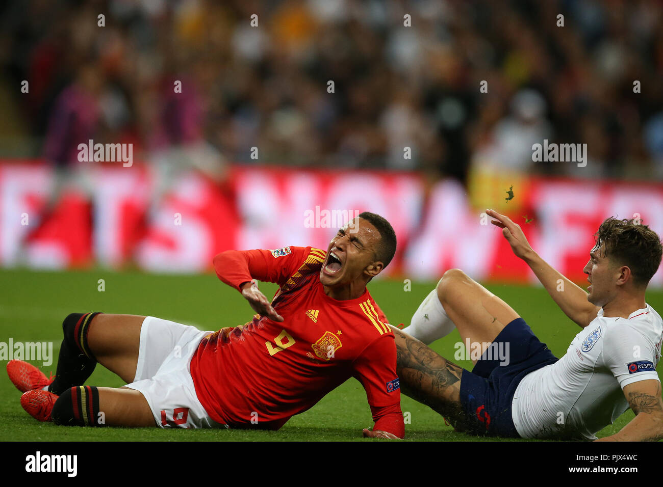 London, UK. 08th Sep, 2018. John Stones of England fouls Rodrigo of Spain. UEFA Nations league A, group 4 match, England v Spain at Wembley Stadium in London on Saturday 8th September 2018.  Please note images are for Editorial Use Only. pic by Andrew Orchard/Alamy Live news Credit: Andrew Orchard sports photography/Alamy Live News Stock Photo