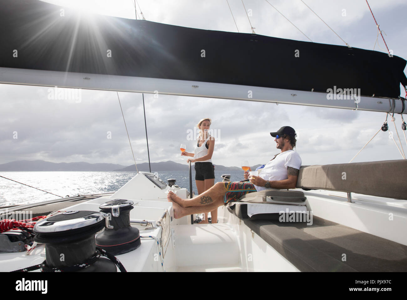 Man and woman sailing, British Virgin Islands Stock Photo
