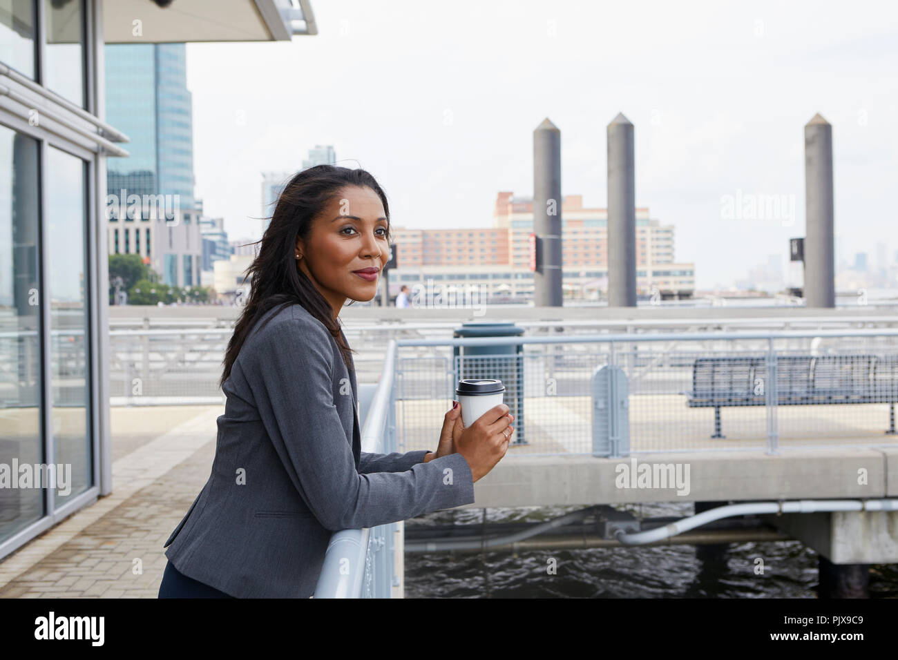 Businesswoman taking coffee break Stock Photo - Alamy