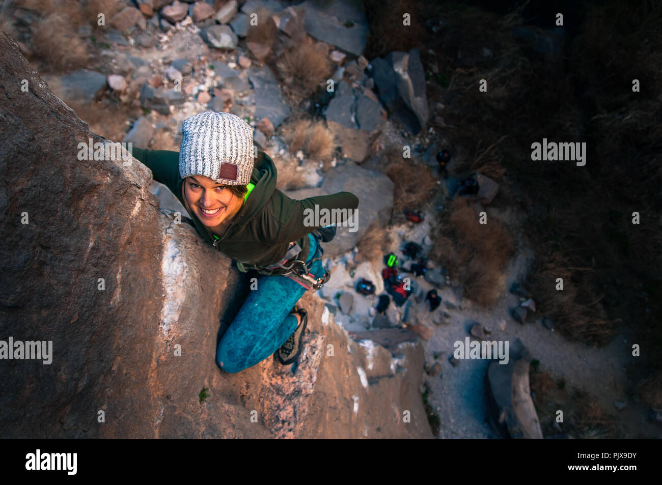 Woman rock climbing, Owens River California, USA Stock