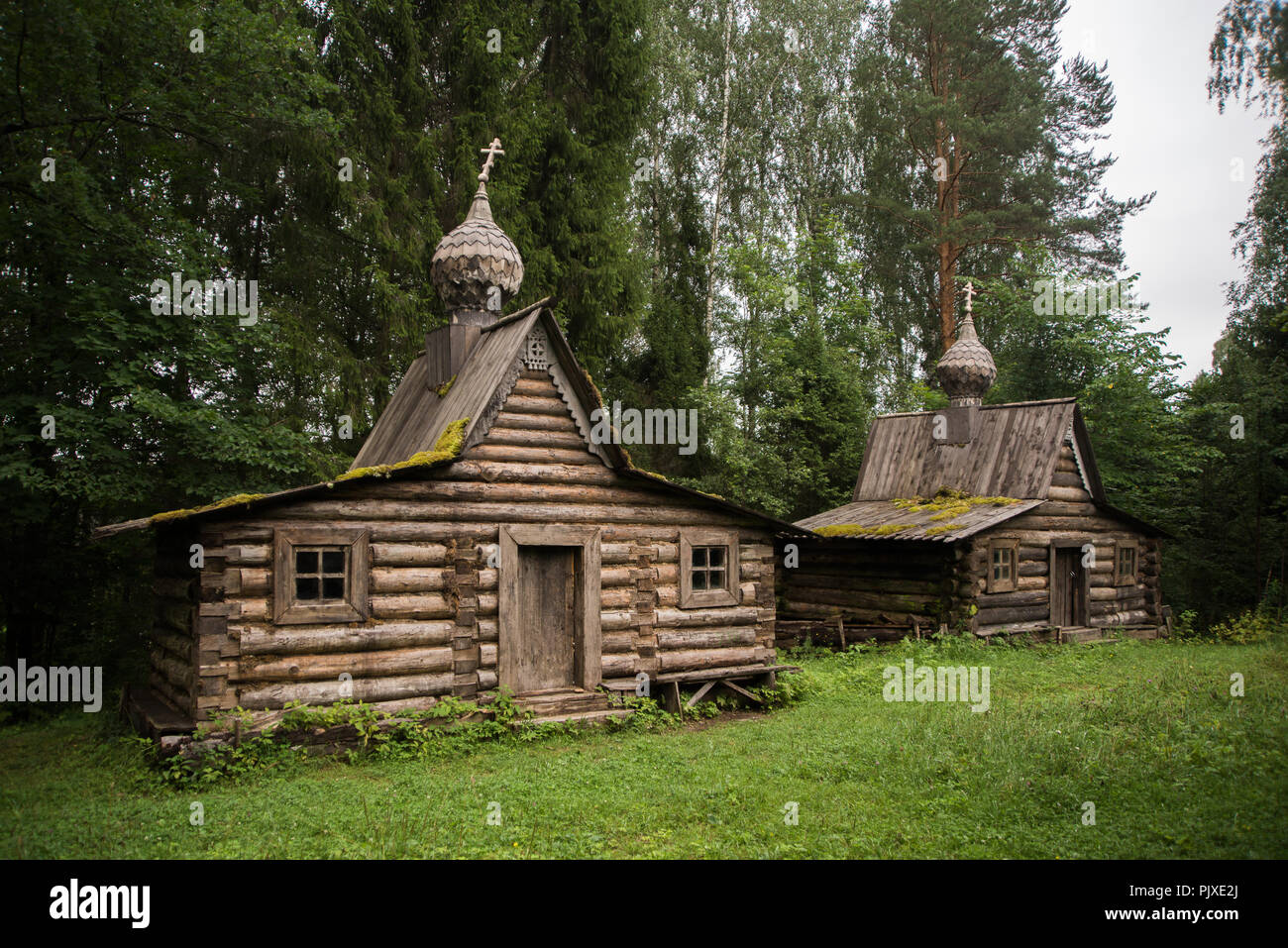 Two ancient wooden chapels, wooden architecture of the Russian north Stock Photo