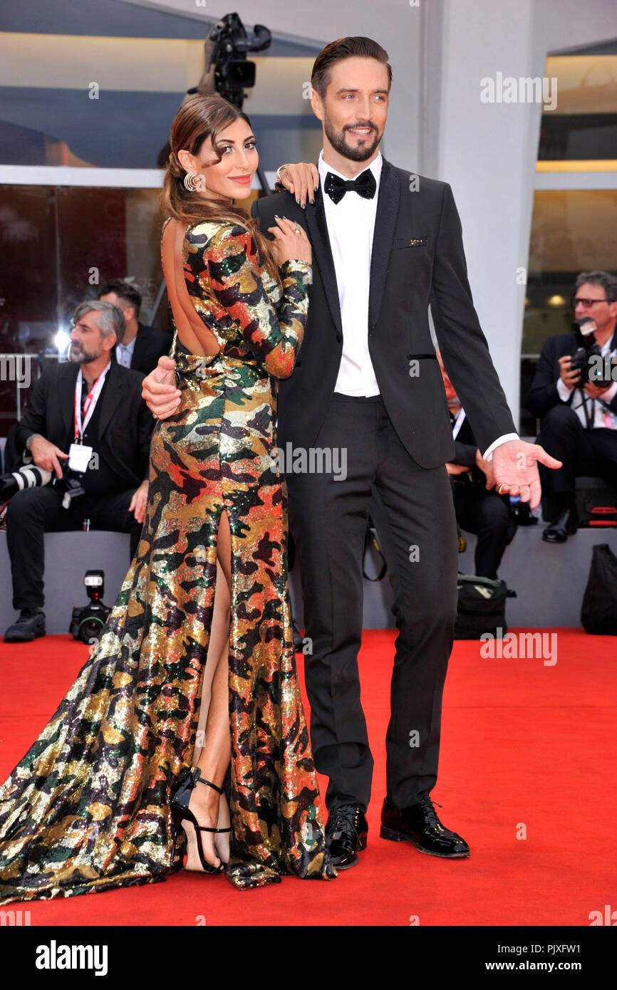 Mila Suarez and Alex Belli attending the 'Un People et Son Roi / One  Nation, One King' premiere at the 75th Venice International Film Festival  at the Palazzo del Cinema on September