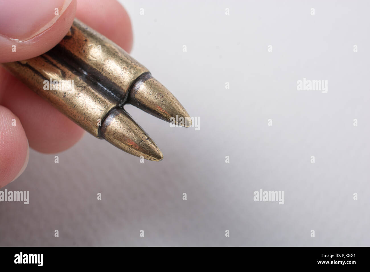 Bullet in the hand as Conceptual photography against the war Stock ...