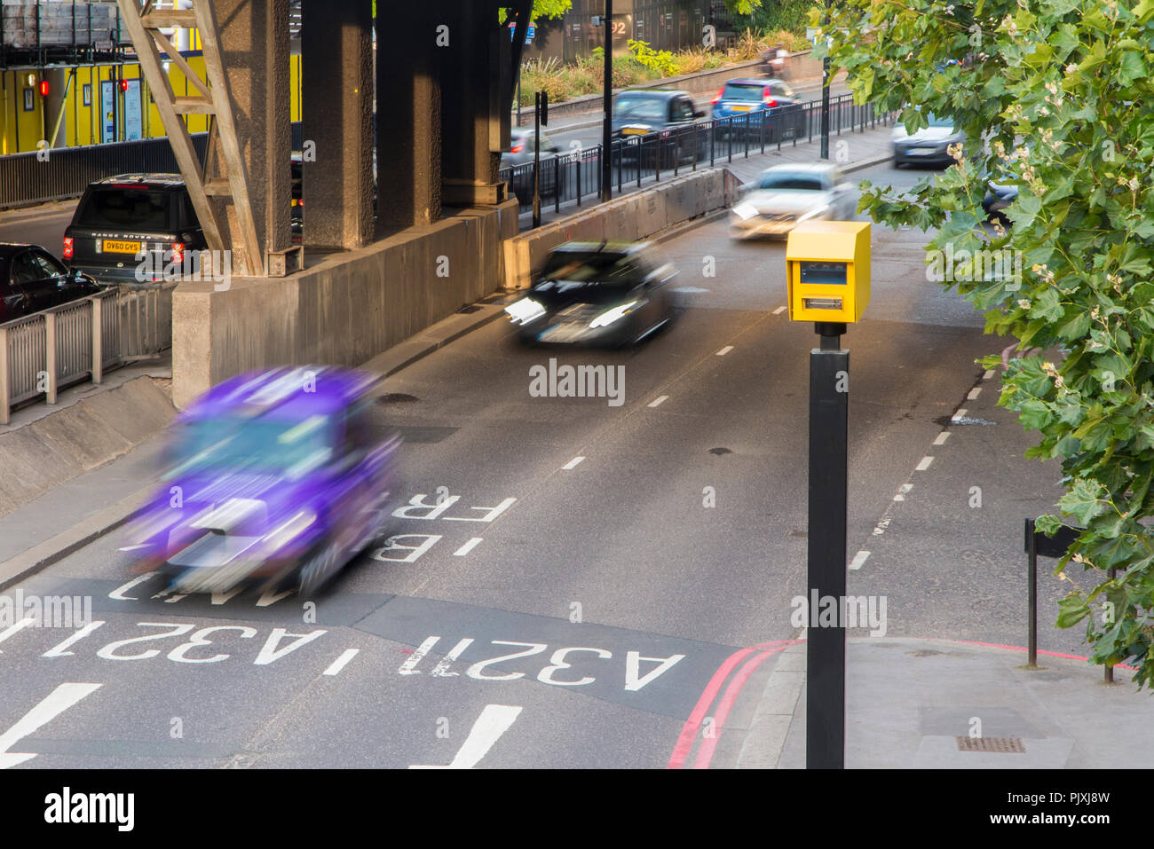 cars speeding through a speed trap in central London Stock Photo