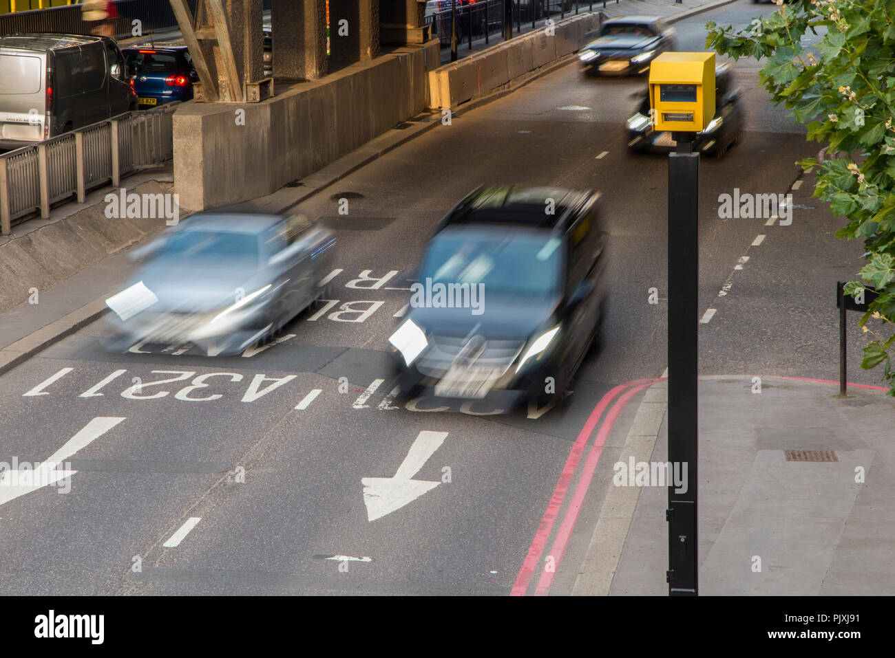 cars speeding through a speed trap in central London Stock Photo