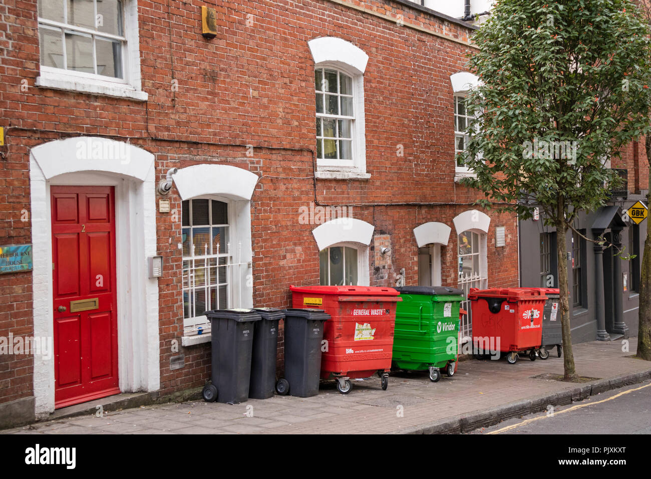 Historic Georgian buildings with unsightly rubbish containers outside, Bristol, England, UK Stock Photo