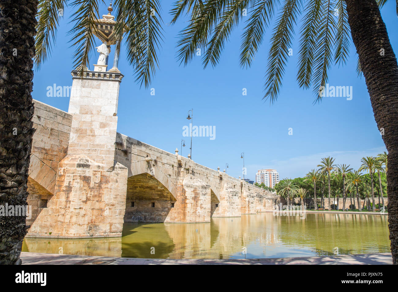 Puente del Mar, one of the five old medieval bridges over the Turia river in Valencia, Spain. The river bed is now landscaped gardens and ponds. Stock Photo