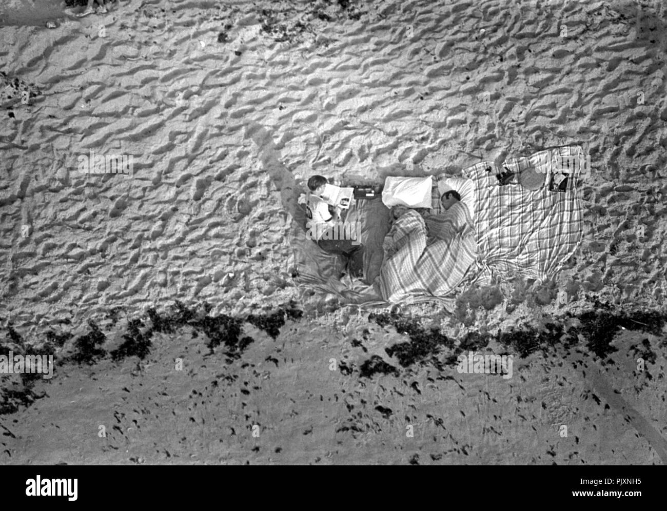 Cape Canaveral, FL - (FILE) -- These three were among the thousands of persons who camped on beaches and roads adjacent to the Kennedy Space Center to watch the Apollo launch on July 16, 1969. An estimated one million persons visited the Spaceport area to see the historic flight, this nation's first attempt to land Americans on the lunar surface. Credit: NASA via CNP /MediaPunch Stock Photo