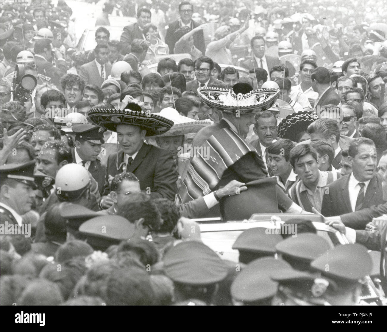 Mexico City, Mexico - (FILE) -- The Apollo 11 astronauts, Neil A. Armstrong, Edwin E. Aldrin, Jr., and Michael Collins, wearing sombreros and ponchos, are swarmed by thousands in Mexico City as their motorcade is slowed by the enthusiastic crowd on September 23, 1969. The GIANTSTEP-APOLLO 11 Presidential Goodwill Tour emphasized the willingness of the United States to share its space knowledge. The tour carried the Apollo 11 astronauts and their wives to 24 countries and 27 cities in 45 days. Credit: NASA via CNP /MediaPunch Stock Photo