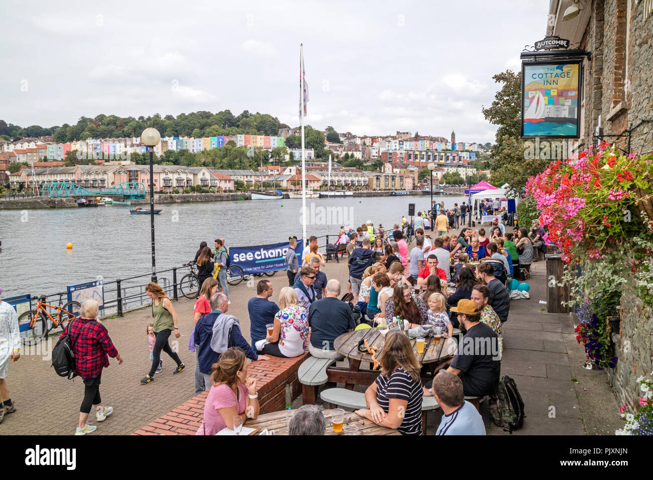 People Relaxing At The Cottage Inn On The Harbourside Bristol