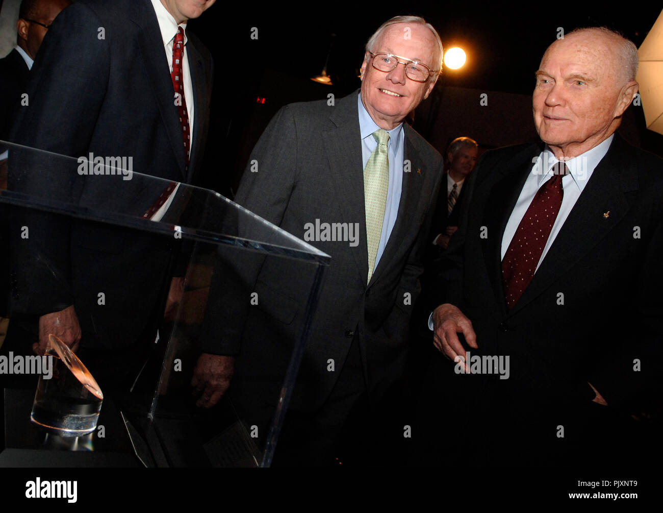 Apollo 11 astronaut Neil Armstrong (left) and Senator John Glenn (right) look at the Moon rock display at the Cincinnati Museum center.  NASA Administrator Michael Griffin presented the NASA Ambassadors of Exploration award to Neil Armstrong.  Armstrong received the award that includes a moon rock to recognize the sacrifices and dedication of the astronauts and others who were part of the Mercury, Gemini and Apollo programs. A former naval aviator, NASA test pilot and Apollo 11 commander, Armstrong was the first human to ever land a spacecraft on the moon and the first to step on the lunar sur Stock Photo