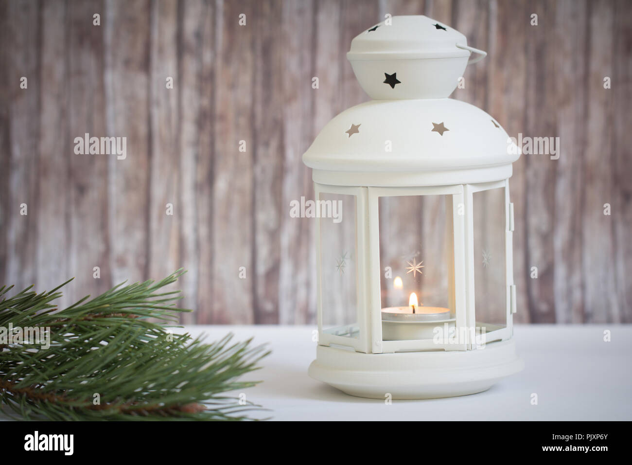 lantern with candle on wood background Stock Photo