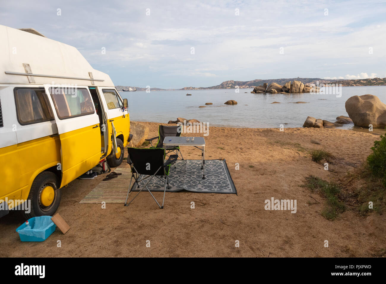 Vintage minivan car on camping spot on beach on Sardinia island, Italy  Stock Photo - Alamy