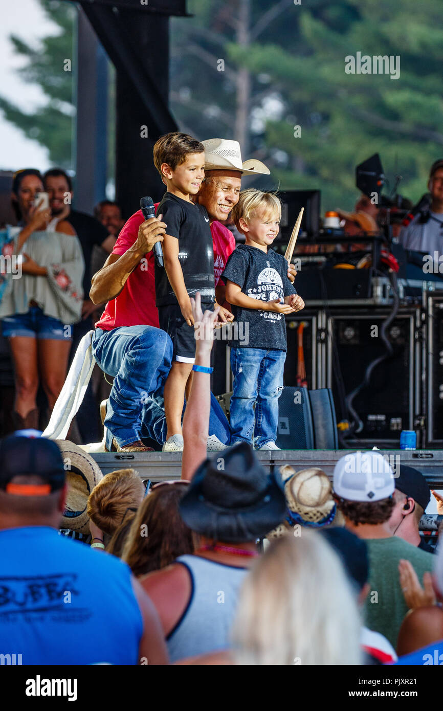 Country singer Neal McCoy on stage with grandchildren at the Hodag Country singer Neal McCoy on stage with grandchildren at the Hodag