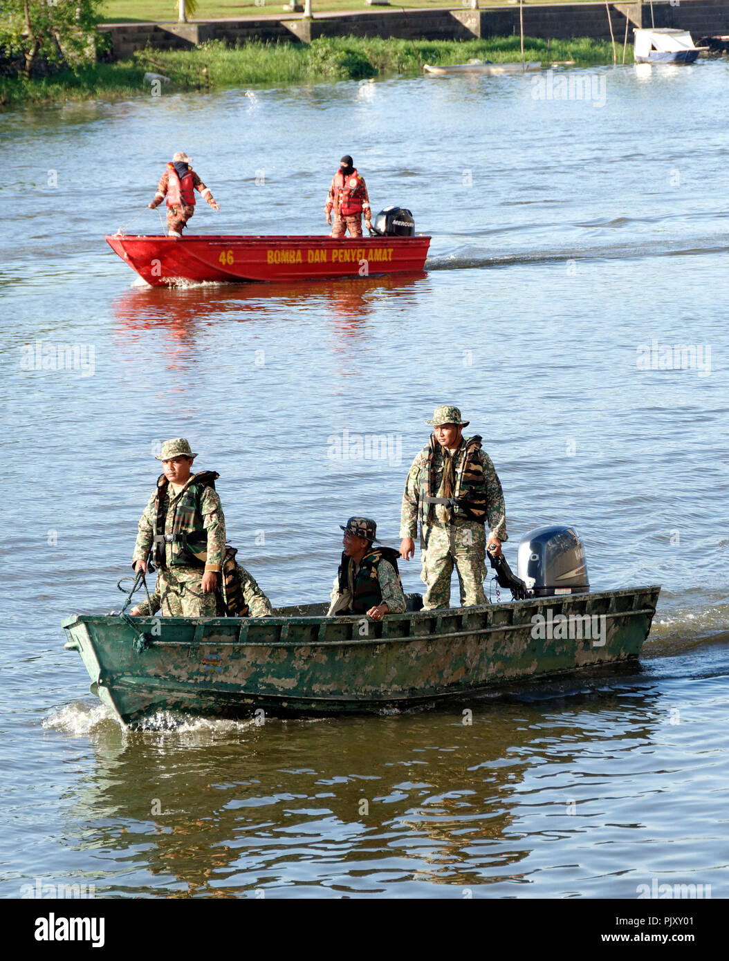 Kuching, Sarawak river, boats fire services and soldiers form part of the Gawai day parade and celebration Stock Photo