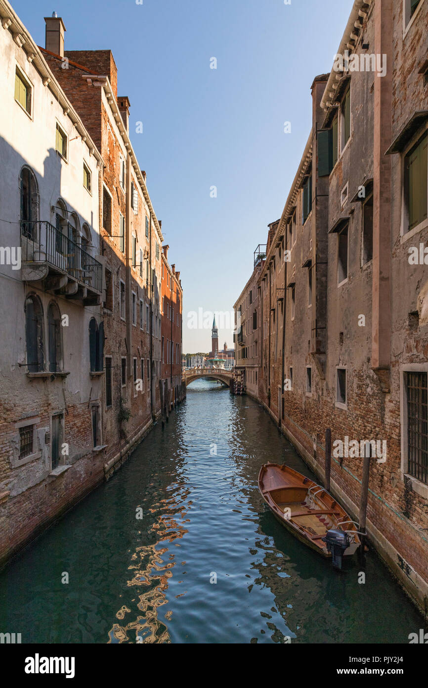 Looking along Rio de la Pleta towards the tower of Chiesa San Giorgio Maggiore in the distance, Venice, Italy. Stock Photo