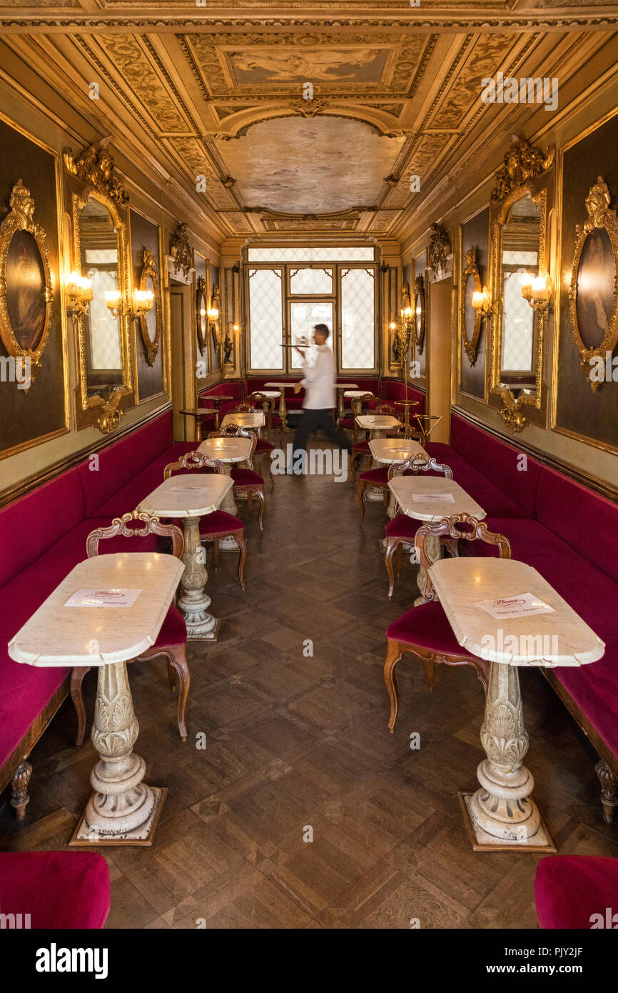 A waiter in the Cafe Florian in St Marks Square ( Piazza San Marco ) Venice , Italy Stock Photo