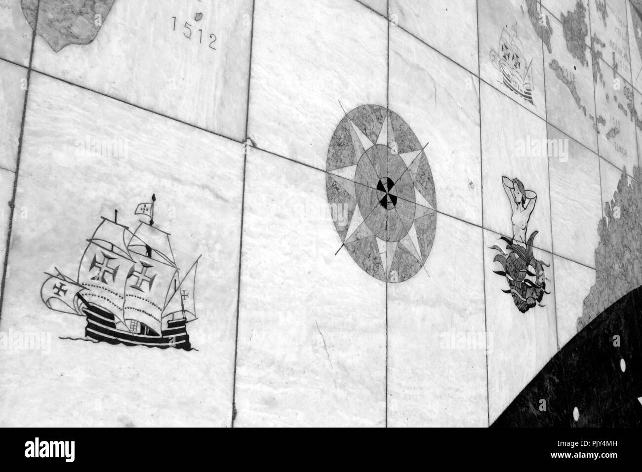 Detail of marble sidewalk near the Belem Tower representing a mythological sea being, mermaid, and a caravel Stock Photo