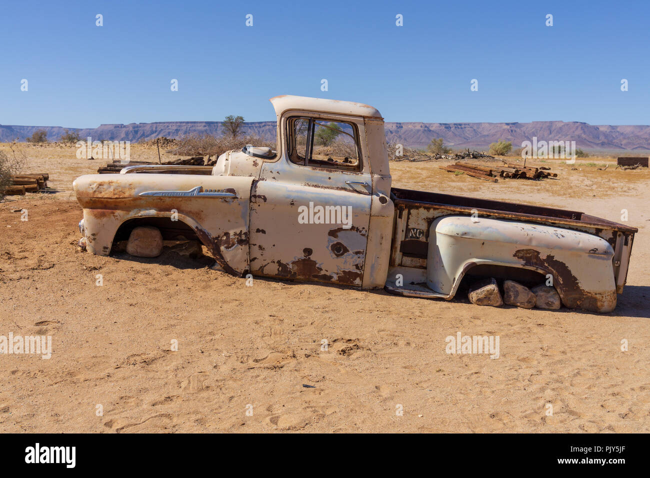 old rust pickup car desert sand africe summer Stock Photo