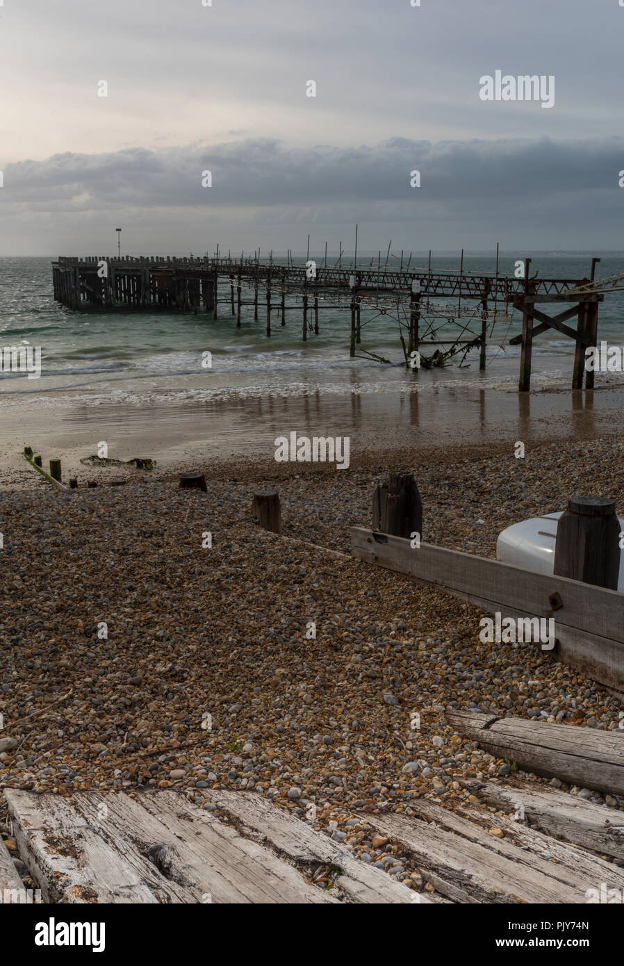 atmospheric seascape and old derelict pier at totland near freshwater
