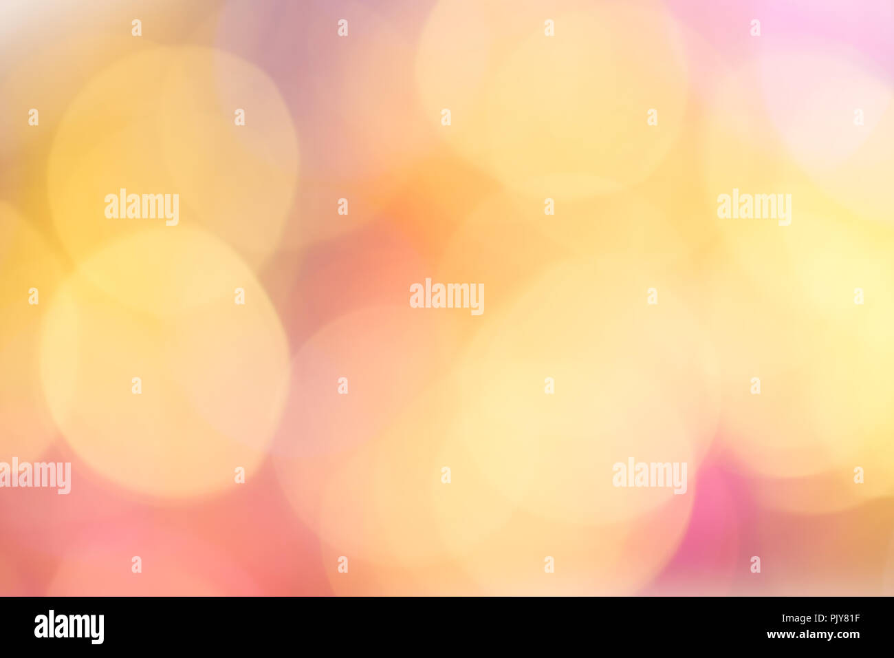 Abstract bokeh light. Christmas mood. Orange, pink, golden and blue lights. Stock Photo