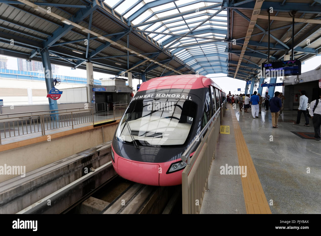 Mumbai Monorail train running and commuters sitting & standing in the
