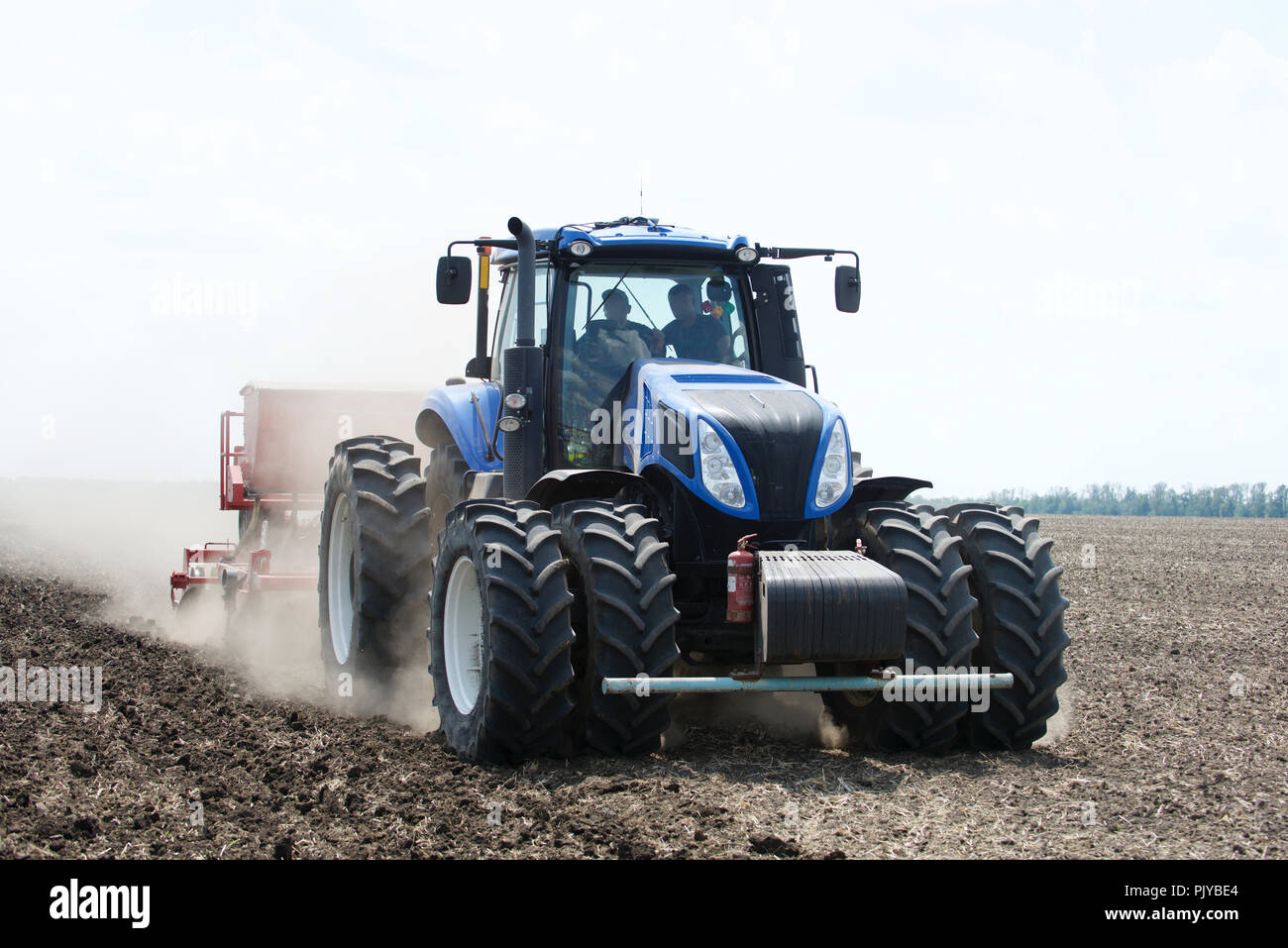 the tractor plows a field Stock Photo - Alamy