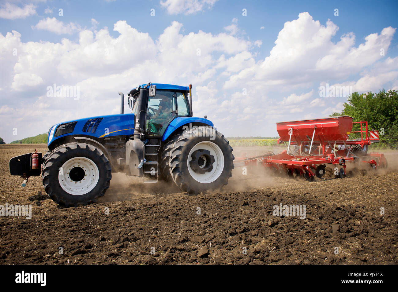 the tractor plows a field Stock Photo - Alamy